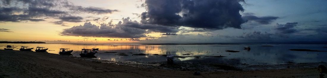 Panoramic view of sea against sky during sunset