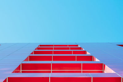 Low angle view of building against clear blue sky