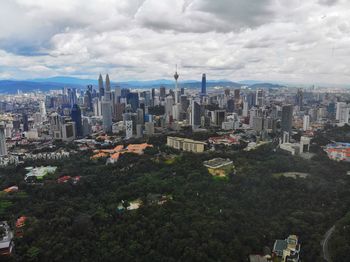 High angle view of city buildings against sky