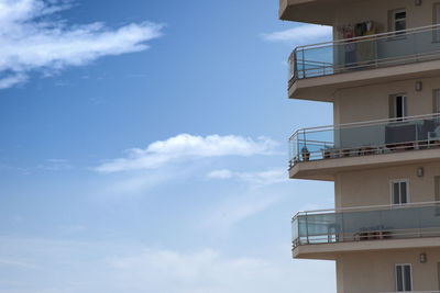 Low angle view of building against sky. balconies with sky on background