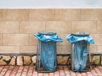 Clothes drying on clothesline against wall