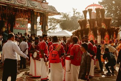 People standing outside temple