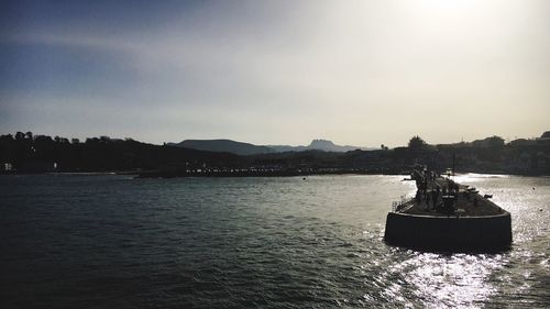 Pier in sea against sky