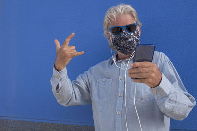 Low angle view of man wearing sunglasses