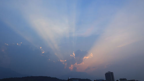 Low angle view of silhouette buildings against sky during sunset
