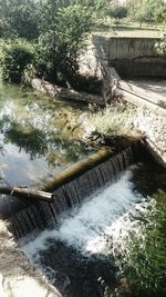 Scenic view of river flowing through dam