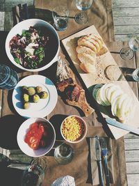 Directly above shot of various food served on table