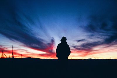 Silhouette of landscape against dramatic sky