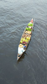 High angle view of man floating on lake