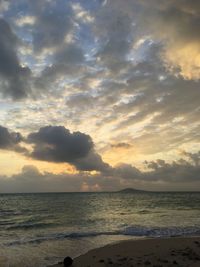 Scenic view of beach against sky during sunset