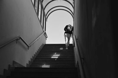 Man walking up stairs