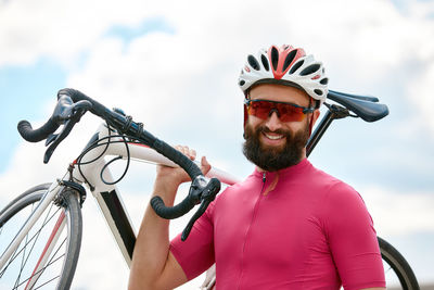 Portrait of young man riding bicycle