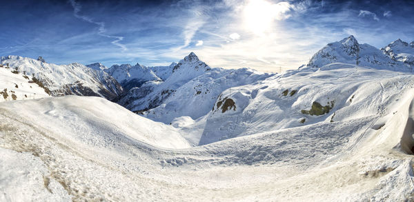 Scenic view of snowcapped mountains against sky