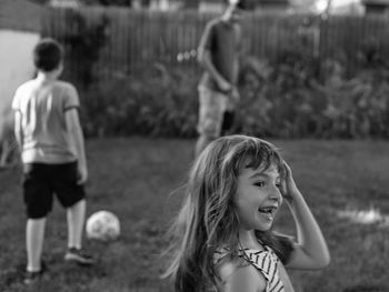 Portrait of happy girl standing on land