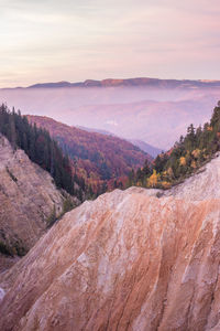 High angle view of land against sky during sunset