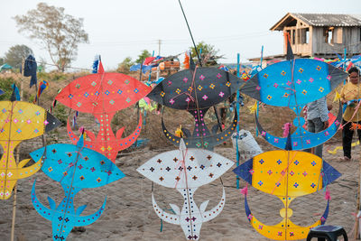 Multi colored kites hanging for sale in market