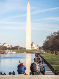 Rear view of people on water