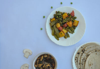 High angle view of chopped fruits in bowl on table