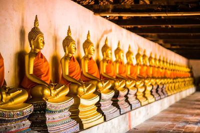 Sculpture of buddha statue in temple outside building