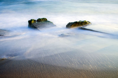 Aerial view of sea on sunny day