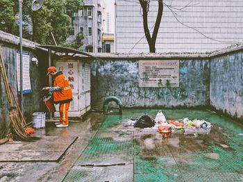 Man working on street in city
