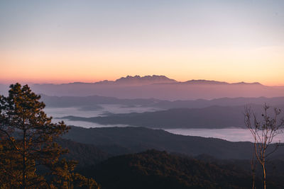 Scenic view of mountains against sky during sunset