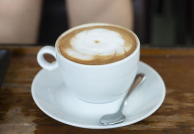 Close-up of coffee cup on table