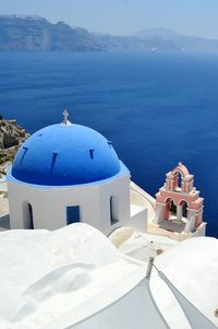 High angle view of church against blue sea