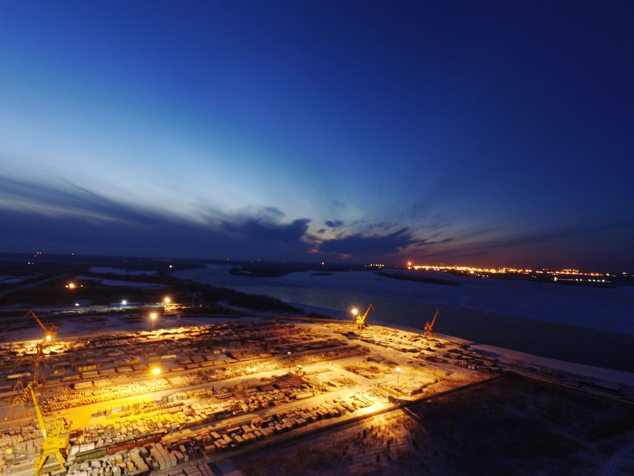 sea, night, illuminated, airplane, city, cityscape, built structure, no people, nature, beauty in nature, outdoors, sky, water, architecture, astronomy