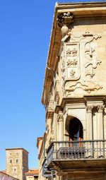 Low angle view of historical building against blue sky