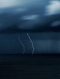 View of lightning over sea