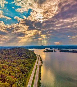 High angle view of river against sky at sunset