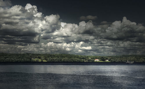 Scenic view of sea against cloudy sky