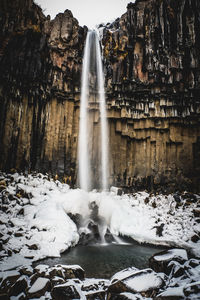 Scenic view of waterfall during winter