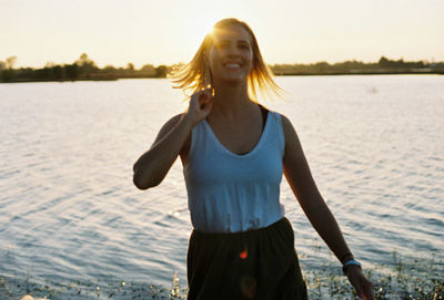 Young woman standing in water