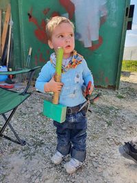 Portrait of boy standing outdoors