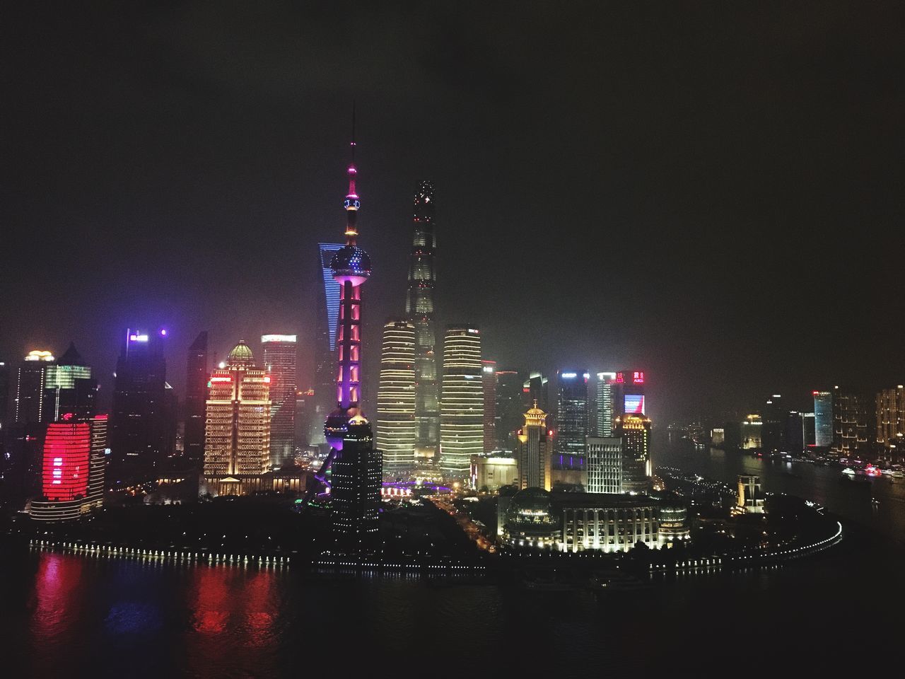 ILLUMINATED SKYSCRAPERS AT NIGHT