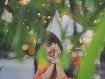 Portrait of smiling young woman outdoors