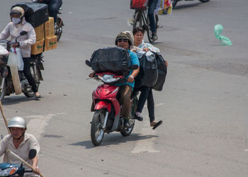 People on road in city