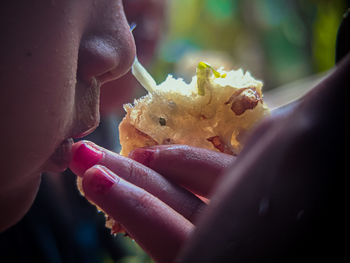 Close-up of hand holding ice cream