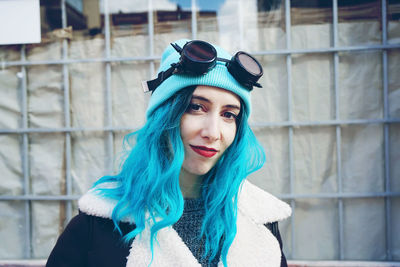 Close-up of fashionable woman with dyed blue hair in city