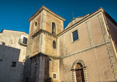 Low angle view of building against blue sky