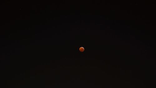 Low angle view of moon against sky at night