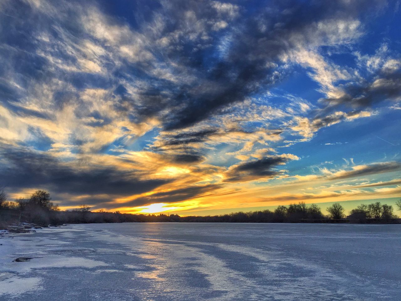 sunset, tranquil scene, scenics, tranquility, sky, beauty in nature, cloud - sky, snow, cold temperature, winter, nature, weather, idyllic, landscape, orange color, season, cloud, tree, non-urban scene, cloudy