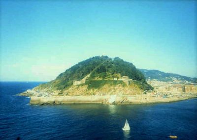 Scenic view of sea against blue sky