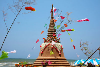 Low angle view of sculpture against sky