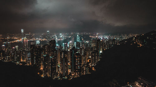 Aerial view of illuminated cityscape against clear sky at night