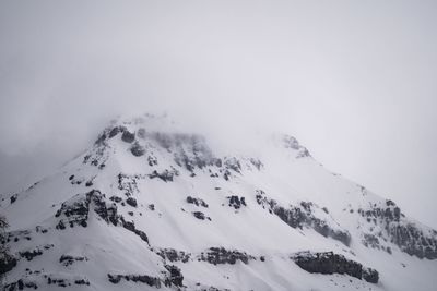 Scenic view of snow covered mountain against sky
