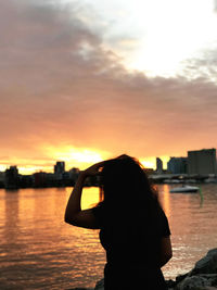 Man photographing at sunset