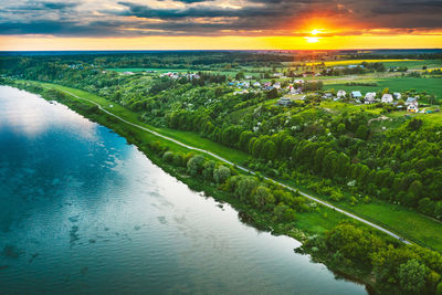 Scenic view of lake against sky during sunset